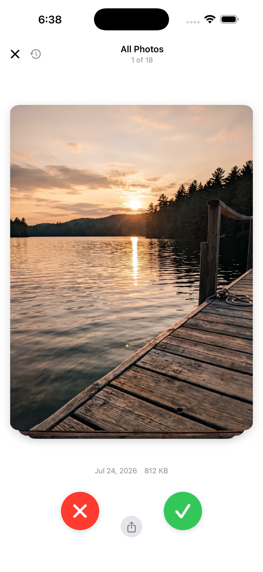 A photo filling the screen with a red delete button and a green keep button below it
